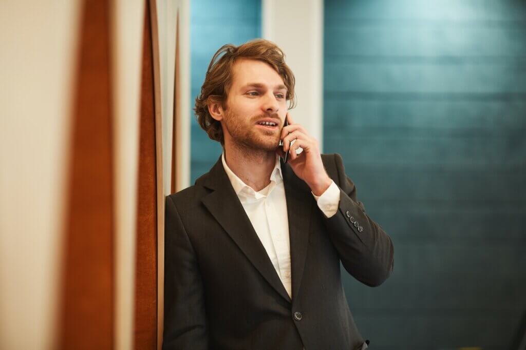 Successful Young Businessman Speaking by Phone